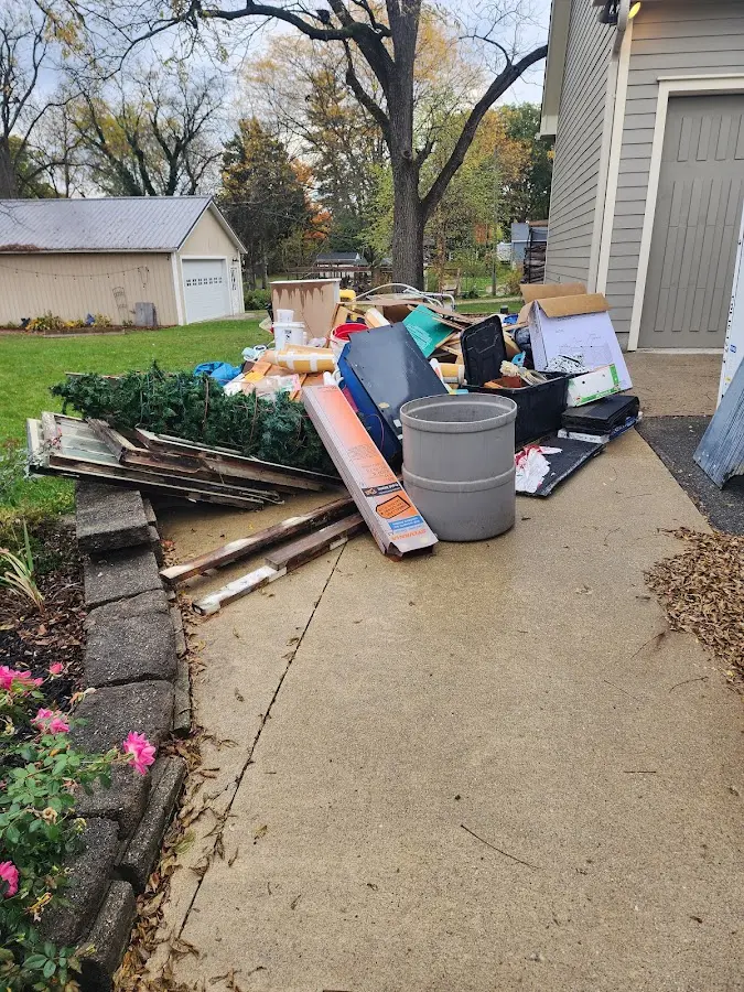 Dumpster being loaded with debris for Residential Dumpster Rental in Cockeysville